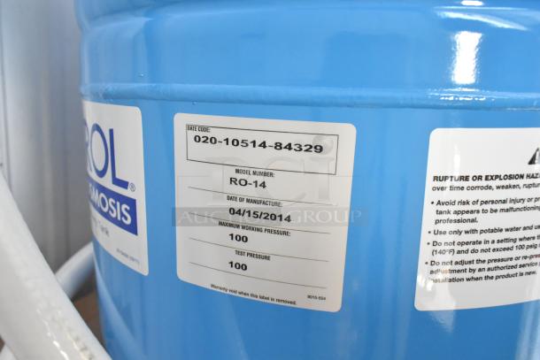 Blue WellXtrol WX-202 tank, model RO-14, manufactured 04/15/2014. Visible label with date code and safety instructions.