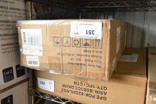 Brand new hitch bike rack in sealed box, labeled with item info and shipping details; weight and dimensions visible.