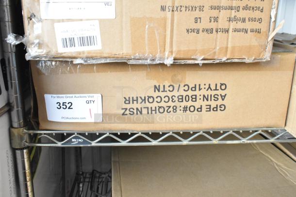 Brand new cardboard box containing B0B3CCQKHR wire shelf set; packaging intact, label indicates auction item #352.