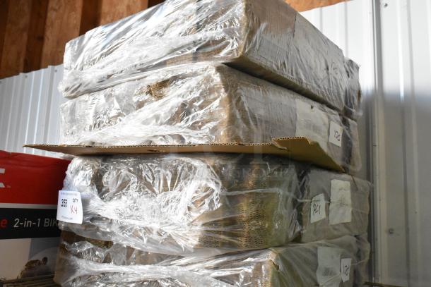 Four brand new bundles of cardboard wrapped in plastic, labeled for auction with a quantity tag indicating "4X."