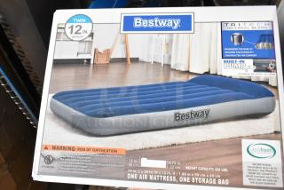 Brand new Bestway inflatable mattress in box, twin size, 12-inch height, built-in pump, antimicrobial protection.