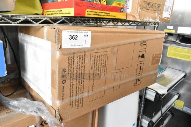 Brand new Waykar YDZ-150 dehumidifier in sealed box, labeled for auction. Box shows handling icons and product warnings.