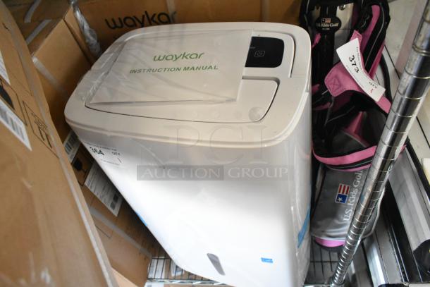 Brand new Waykar YDZ-150 dehumidifier with instruction manual, pristine condition, in original packaging.