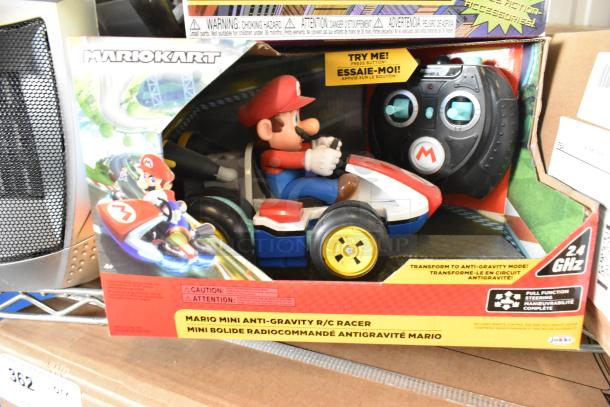 Brand new Mario Kart Mini Anti-Gravity R/C Racer in box, includes remote. Features 2.4 GHz steering.