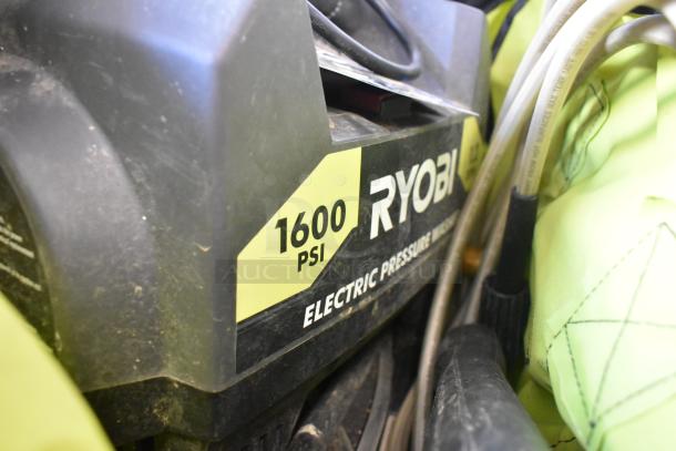 Ryobi 1600 PSI Electric Pressure Washer, visible markings, compact design, used condition, includes hose attachments.