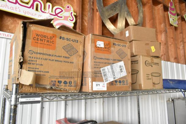 Five brand new boxes on a shelf, including World Centric pizza boxes and Choice plastic portion cups. Boxes show product details and labels.