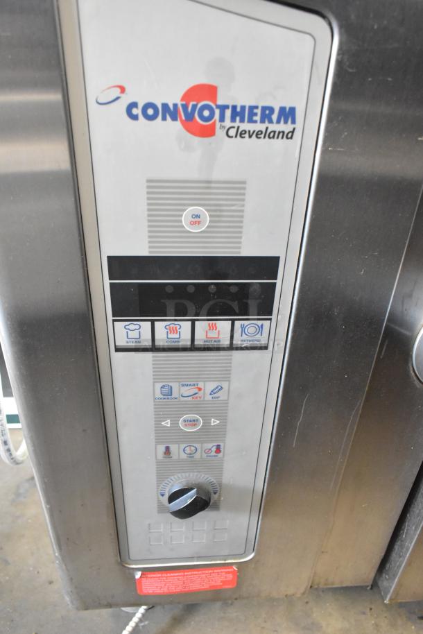 Convotherm OGB-6.20 stainless steel combi convection oven control panel, featuring on/off and cooking mode buttons.
