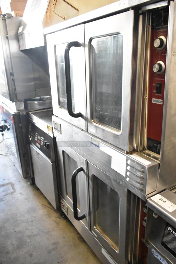 2 Southbend stainless steel full-size convection ovens with view-through doors, thermostatic controls, on commercial casters.