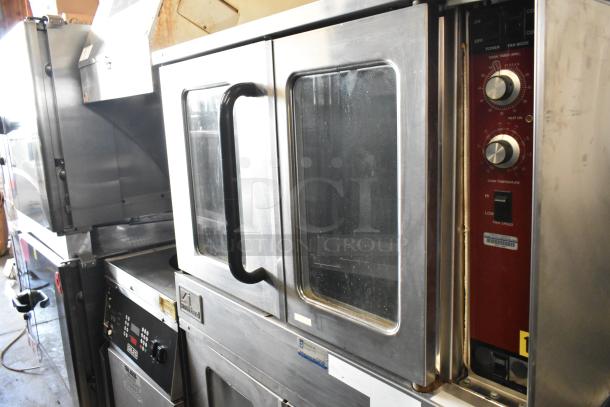 Southbend stainless steel commercial convection oven with view-through doors, thermostatic controls, on casters.