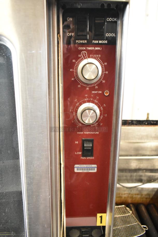 Stainless steel Southbend convection oven panel with thermostatic controls, timer, and fan speed settings.