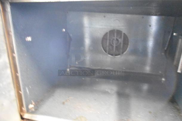 2 Southbend stainless steel convection oven interiors with view-through doors, thermostatic controls, commercial casters.