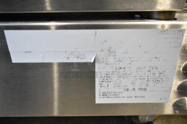 Southbend stainless steel convection oven label showing specifications and usage instructions. Blurred text.