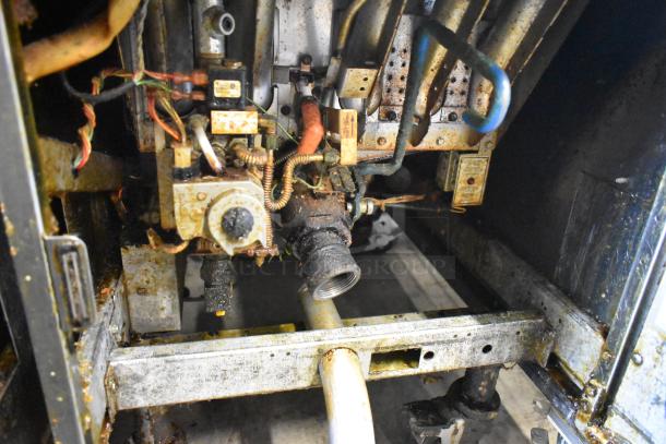 Pitco Frialator SSH75 deep fryer interior showing natural gas connections and components, suitable for repair or parts.