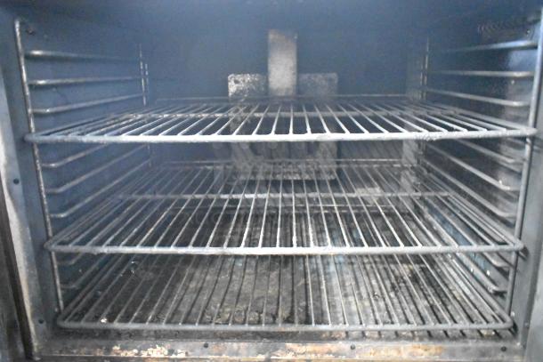 Hobart HGC5-10 convection oven interior with metal oven racks, stainless steel, view-through doors, thermostatic controls.