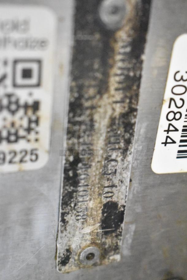Worn identification plate of Hobart HGC5-10 convection oven, partially visible model number inscribed.
