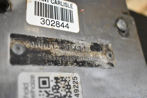 Hobart HGC5-10 convection oven plate showing model number and barcode. Stainless steel surface, some wear visible.