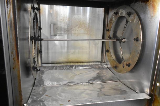 Fri-jado TDR7-P stainless steel rotisserie oven, natural gas powered, commercial floor style, interior view showing usage wear.