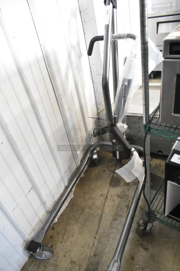 Proactive metal frame on commercial casters, in new condition, features durable handlebars and sturdy wheels for mobility.