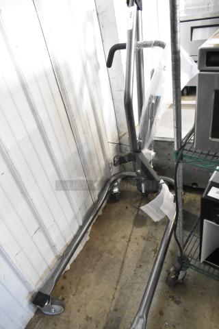 Proactive metal frame on commercial casters, in new condition, features durable handlebars and sturdy wheels for mobility.