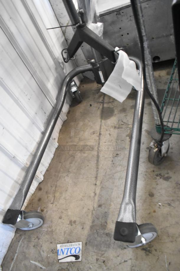 Proactive metal frame on commercial casters, sturdy and durable, in good condition. Includes ANCO Refrigeration label.