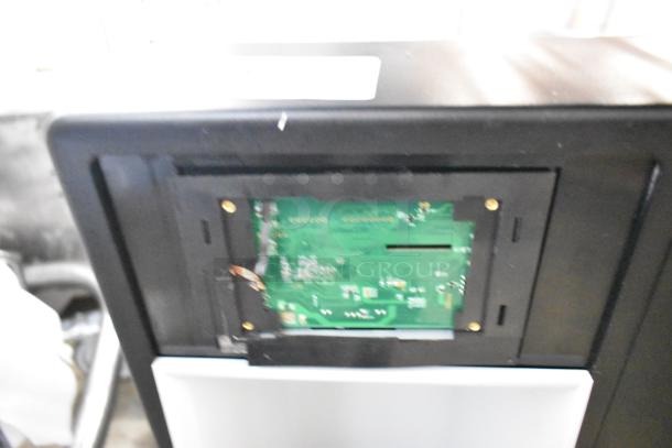 2024 Follett 7CI112A-IW-NF-ST-00 countertop ice maker and dispenser, green circuit board exposed, generally good condition.