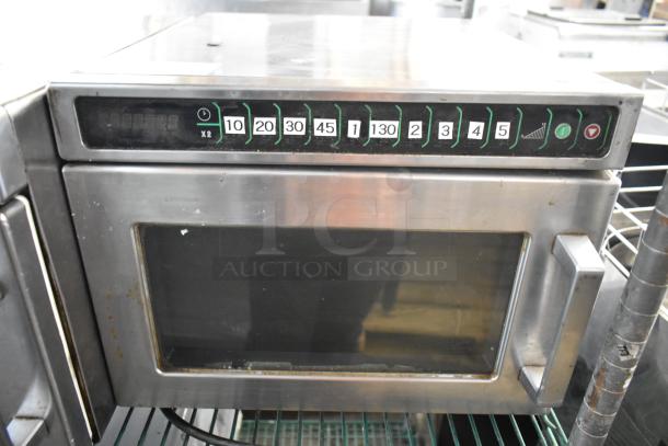 Menumaster MDC182 stainless steel commercial microwave oven, 208/230V, 1 phase, visible wear, keypad with numbered settings.
