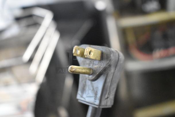 Close-up of a power plug detail on a 2019 Habco SE18 single door cooler, highlighting its 115V, 1 phase connection.