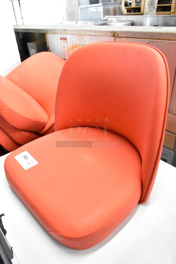 Brand new red bucket-style stool seat without frame, clean condition, auction lot tag visible.