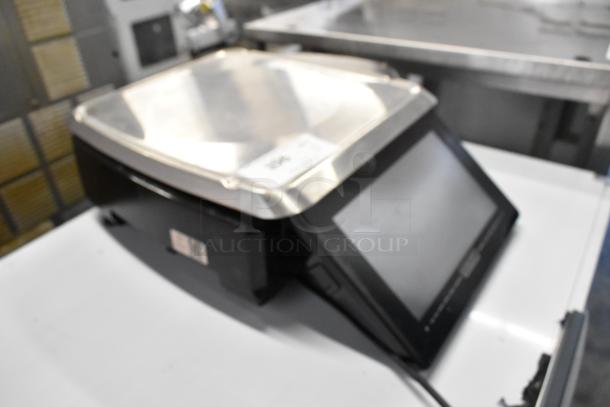 2023 Hobart HTi metal commercial countertop food portioning scale, black and silver, with digital display.