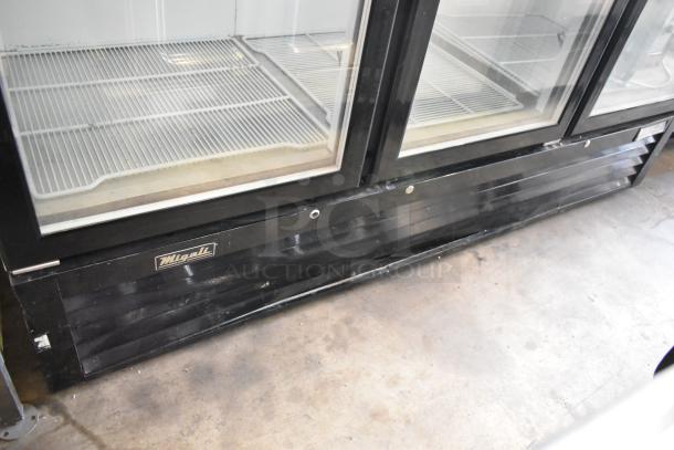 2018 Migali C-72FM commercial freezer, 3-door, poly coated racks, metal body. Visible Migali logo on lower panel.