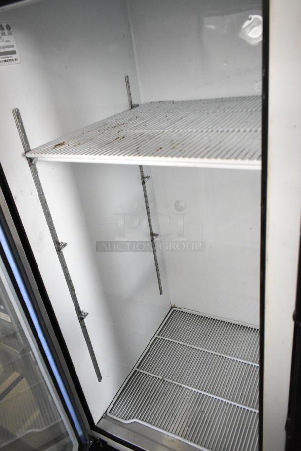 2018 Migali C-72FM 3-door reach-in freezer with poly coated racks, 115/208-230V, 1 phase, clean interior, minor wear.