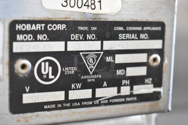 Hobart HC24EA5 steam cabinet label showing model, serial number, ANSI/NSF classification, and electrical specs.