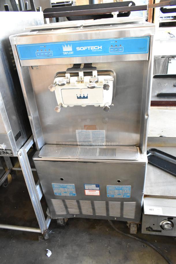 Taylor 754-27 stainless steel soft serve ice cream machine, two flavors with twist function, on casters, 208-230V, 1 phase.