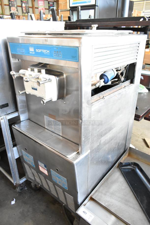 Taylor 754-27 stainless steel soft serve ice cream machine, 2-flavor with twist, on commercial casters. 208-230V, 1 phase.