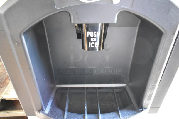 Brand new Avantco 194HBN12022 hotel ice dispenser, 22" wide, 120 lb. capacity, slight cosmetic scratches, "PUSH FOR ICE" label.