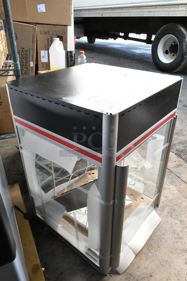 Brand new Hatco FSDT-2 display cabinet, scratch and dent condition, with four-tier circle rack and motor, 120V, 1 phase.