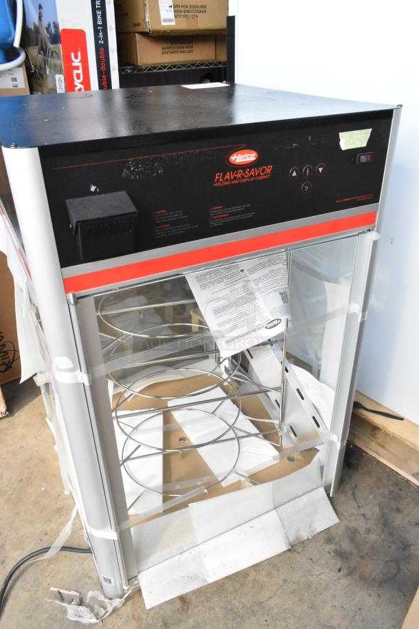 Brand new Hatco FSDT-2 holding and display cabinet, four-tier rack, black and red finish, 120V, 1 Phase, scratch and dent condition.