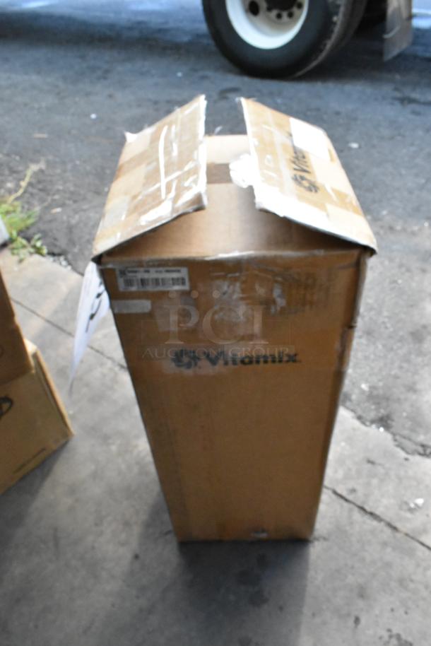 Box for brand new 2025 Vita-Mix VM0805B Mix'n Mixer with scratch and dent label, visible Vita-Mix logo and barcodes.