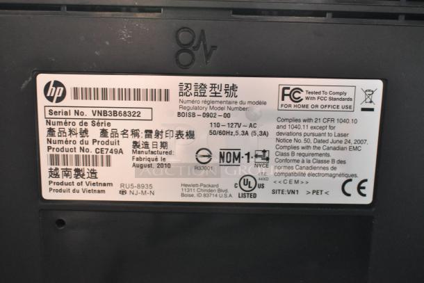 HP LaserJet P1606dn printer label showing serial number VNB3B68322, model BOISB-0902-00, product CE749A, made in August 2010.