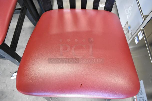 Black dining height chair with red seat cushion, minor wear; 14 chairs bundled for auction bidding.