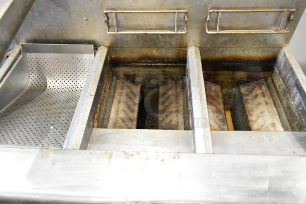 Frymaster FMPH255CSC stainless steel 2-bay fryer with filtration and dumping station, 80,000 BTU, on casters, used condition.