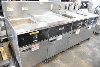 Giles EOF-24 stainless steel 2-bay deep fat fryer with center dumping station, commercial casters, 480V, 3-phase.
