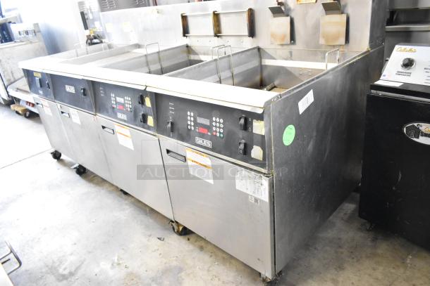 Giles EOF-24 stainless steel 2-bay deep fat fryer with center dumping station, on casters, 480V, 3 phase, used condition.