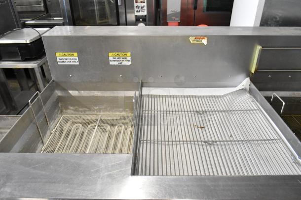 Giles EOF-24 stainless steel commercial 2-bay deep fryer with center dumping station, on casters, 480V, 3-phase.