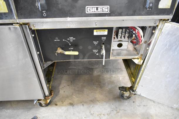Giles EOF-24 stainless steel commercial 2-bay deep fat fryer with center dumping station, visible controls, and casters. 480V, 3-phase.