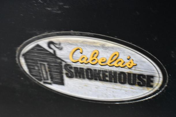 Pro Smoker N Roaster PK50PP metal commercial electric smoker, 120 volts, 1 phase, with Cabela's Smokehouse logo.