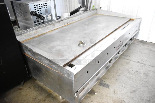 Vulcan stainless steel commercial countertop flat top griddle with thermostatic controls; shows signs of use.
