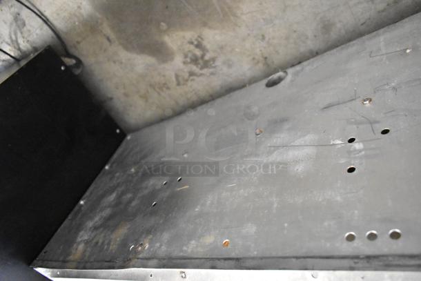 Vulcan stainless steel commercial griddle with thermostatic controls, rustic condition, visible wear and rust marks.