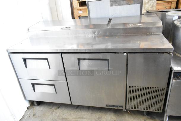 True TPP-67D-2 stainless steel commercial pizza prep table with door, 2 drawers, 115 volts, 1 phase, good condition.