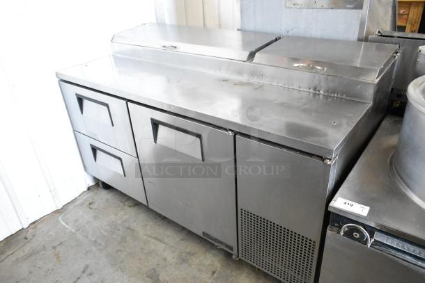 True TPP-67D-2 stainless steel commercial pizza prep table with one door and two drawers, 115 volts, 1 phase.